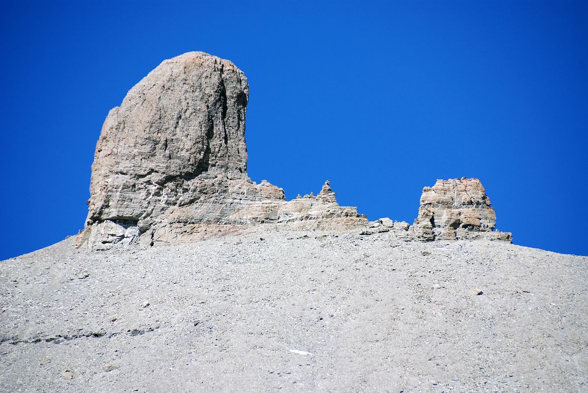 16 Lingam Shaped Rock On Western Wall Of Kailash On Mount Kailash Inner Kora Nandi Parikrama Here is a side view of the lingam-shaped rock protruding from the west wall of the Mount Kailash Inner Kora (09:48). The final steep climb begins now (5532m).